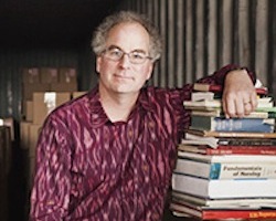Brewster Kahle, founder of the Internet Archive, a nonprofit organization devoted to preserving Web pages, inside his repository for storing books in Richmond, Calif., Feb. 21, 2012. Kahle has started amassing physical texts in case they're needed for future digitization -- and because he abhors throwing them out. (Lianne Milton/The New York Times)