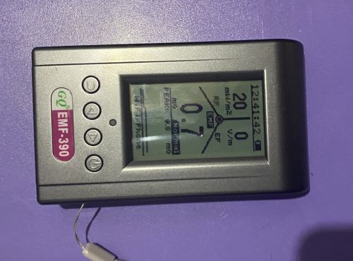 GQ EMF-390 showing 20 mW/m² broadband live reading facing right during directional router test